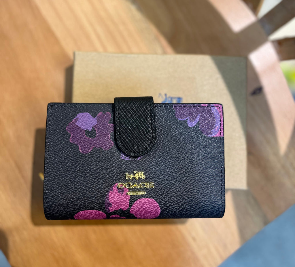 Coach women’s pouch ( black multi floral )