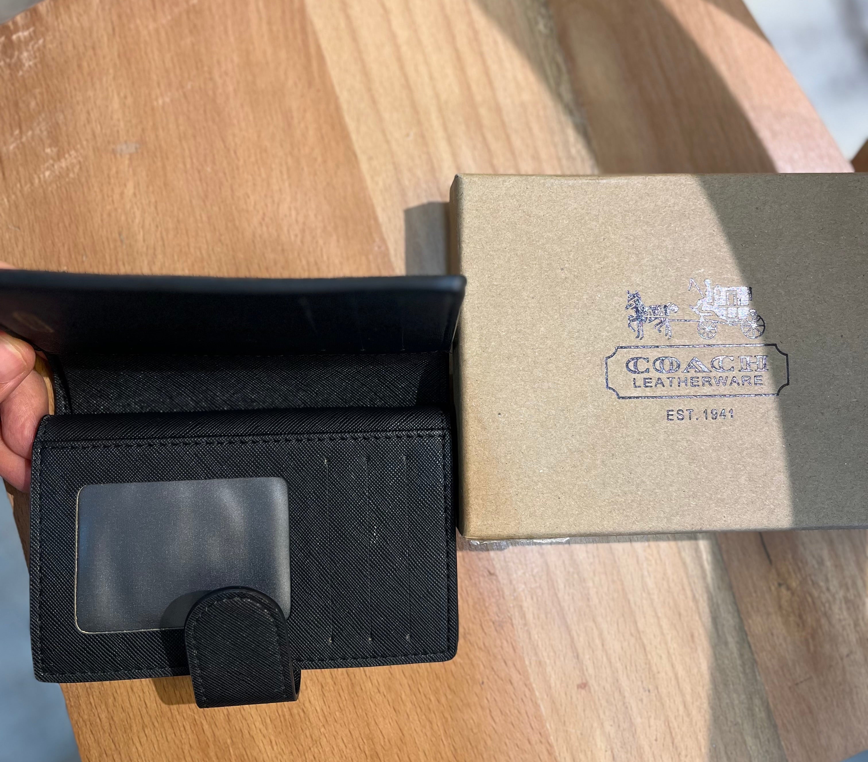 Coach women’s pouch ( black multi floral )